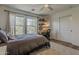 Bedroom with cozy rug, bright windows, and decoratively styled shelf for a clean and inviting atmosphere at 1379 S Claiborne Ave, Gilbert, AZ 85296