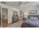 Light-filled bedroom with hardwood floors, dresser, cozy rug, and decorative items adding a touch of character at 1379 S Claiborne Ave, Gilbert, AZ 85296