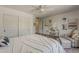 Bright bedroom featuring a seating area, closet, and a vanity, perfect for relaxation and personal care at 1379 S Claiborne Ave, Gilbert, AZ 85296
