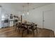 Modern dining room featuring pendant lighting, hardwood floors, and seating for four at 1379 S Claiborne Ave, Gilbert, AZ 85296