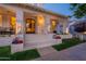 Elegant front entrance featuring decorative columns, a decorative door, and beautiful landscaping at 1379 S Claiborne Ave, Gilbert, AZ 85296
