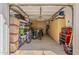 Organized garage space with built in storage, cabinets, storage shelving, bikes, and plenty of open space at 1379 S Claiborne Ave, Gilbert, AZ 85296