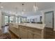 Gourmet kitchen with a large island, stainless steel appliances and a bright breakfast nook at 1379 S Claiborne Ave, Gilbert, AZ 85296