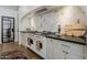 Gourmet kitchen with a marble backsplash, custom cabinetry, and a high-end stainless steel range at 1379 S Claiborne Ave, Gilbert, AZ 85296