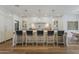 Spacious gourmet kitchen featuring a large center island with pendant lighting and seating at 1379 S Claiborne Ave, Gilbert, AZ 85296