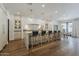 Gourmet kitchen boasts a large island, marble counters, custom cabinetry, and high end appliances at 1379 S Claiborne Ave, Gilbert, AZ 85296
