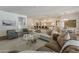 Bright living room open to the gourmet kitchen and showcasing the seamless floorplan of the home at 1379 S Claiborne Ave, Gilbert, AZ 85296