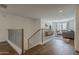 Comfortable living area with staircase and natural light from the nearby windows at 1379 S Claiborne Ave, Gilbert, AZ 85296