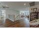 Open-concept living space with hardwood floors and elegant staircase at 1379 S Claiborne Ave, Gilbert, AZ 85296