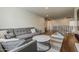 Comfortable living area with sectional sofa, coffee table, and modern television at 1379 S Claiborne Ave, Gilbert, AZ 85296