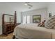 Comfortable main bedroom features a dresser, desk, neutral tones, and natural light at 1379 S Claiborne Ave, Gilbert, AZ 85296
