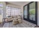 Cozy outdoor patio with comfortable seating, stylish rug, and natural light creating a relaxing retreat at 1379 S Claiborne Ave, Gilbert, AZ 85296