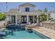 Gorgeous backyard pool with an outdoor bar and inviting covered patio for entertaining at 1379 S Claiborne Ave, Gilbert, AZ 85296