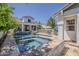Lush backyard with a pristine pool and hot tub, perfect for entertaining and relaxation at 1379 S Claiborne Ave, Gilbert, AZ 85296