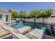Beautiful swimming pool with sun loungers, perfect for relaxation and enjoying the outdoor space at 1379 S Claiborne Ave, Gilbert, AZ 85296