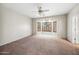 Spacious bedroom has a large bay window and neutral carpet at 14625 W Redfield Rd, Surprise, AZ 85379