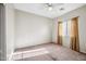 Bedroom with tan carpet, neutral walls, and window with coverings at 14625 W Redfield Rd, Surprise, AZ 85379