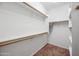 Walk-in closet offers ample shelving and storage space at 14625 W Redfield Rd, Surprise, AZ 85379