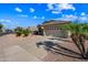 Attractive single-story home featuring desert landscaping, wide driveway, and a two-car garage at 14625 W Redfield Rd, Surprise, AZ 85379