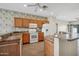 Traditional kitchen with a light wood cabinets, and a view to the sliding glass doors at 14625 W Redfield Rd, Surprise, AZ 85379