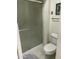 Shower with glass door, toilet, and tile flooring in bathroom at 15438 N Lakeforest Dr, Sun City, AZ 85351