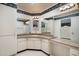 Bathroom featuring extensive counterspace and dual mirror vanities at 15438 N Lakeforest Dr, Sun City, AZ 85351