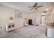 Bedroom featuring ceiling fan and coordinated furniture set with lamps at 15438 N Lakeforest Dr, Sun City, AZ 85351