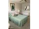 Bright bedroom with white dresser and artwork on the wall at 15438 N Lakeforest Dr, Sun City, AZ 85351