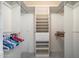 Walk-in closet offering ample storage with shelving and hanging rods at 15438 N Lakeforest Dr, Sun City, AZ 85351