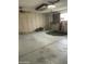 Garage with ceiling fans, ample built-in storage cabinets, and concrete flooring at 15438 N Lakeforest Dr, Sun City, AZ 85351