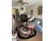 Cozy living room with a blue sofa, floral rug, and natural light creating a comfortable space at 15438 N Lakeforest Dr, Sun City, AZ 85351
