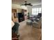 Living room with natural light, comfortable seating, and built-in shelving at 15438 N Lakeforest Dr, Sun City, AZ 85351