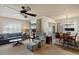 Open-concept living space with ample seating, natural light, and a ceiling fan at 15438 N Lakeforest Dr, Sun City, AZ 85351