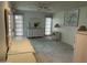Spacious main bedroom with neutral walls, a ceiling fan, and access to the outdoor space at 15438 N Lakeforest Dr, Sun City, AZ 85351
