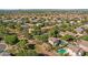 Lovely aerial view of a mature neighborhood featuring lush greenery, pools, and well-maintained homes at 2545 E Harrison Ct, Gilbert, AZ 85295
