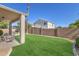 Spacious backyard with a well-maintained lawn, patio area, and privacy fence, ideal for relaxation and entertaining at 2545 E Harrison Ct, Gilbert, AZ 85295
