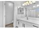 Bathroom features a vanity with black hardware and a mirror with decorative lighting at 2545 E Harrison Ct, Gilbert, AZ 85295