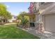 Inviting home exterior featuring a quaint front porch with decorative stone accents at 2545 E Harrison Ct, Gilbert, AZ 85295
