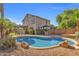 Inviting backyard features a refreshing pool, lush landscaping, and an outdoor kitchen area for entertainment at 2545 E Harrison Ct, Gilbert, AZ 85295