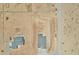 Bird's eye view of two adjacent desert homes with driveways, neighboring lots, and desert terrain at 25893 W Running Deer Trl, Wittmann, AZ 85361