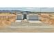Charming single-story home with a symmetrical facade, two-car garage, and desert landscaping at 25893 W Running Deer Trl, Wittmann, AZ 85361