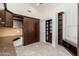 Versatile bedroom with custom built-ins, neutral carpet, and bright, sunny window at 6428 E Nisbet Rd, Scottsdale, AZ 85254