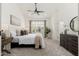 Bright primary bedroom with a ceiling fan and natural light at 6428 E Nisbet Rd, Scottsdale, AZ 85254
