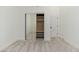 Bright bedroom featuring plush carpeting, a closet with mirrored doors and an ensuite bathroom at 6428 E Nisbet Rd, Scottsdale, AZ 85254
