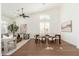 Elegant dining area featuring hardwood floors, vaulted ceilings, and lots of natural light at 6428 E Nisbet Rd, Scottsdale, AZ 85254