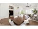 Open dining area with hardwood floors, a bright white color scheme, and modern furnishings at 6428 E Nisbet Rd, Scottsdale, AZ 85254