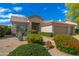 Inviting single-story home with desert landscaping, mature plants, and a covered front porch at 6428 E Nisbet Rd, Scottsdale, AZ 85254