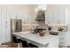 Bright, modern kitchen with stainless steel appliances and white cabinets at 6428 E Nisbet Rd, Scottsdale, AZ 85254