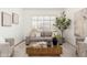 Cozy living area with plush seating, natural light, and neutral color palette at 6428 E Nisbet Rd, Scottsdale, AZ 85254