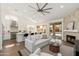 Open-concept living room with fireplace, and sliding doors to the pool area at 6428 E Nisbet Rd, Scottsdale, AZ 85254